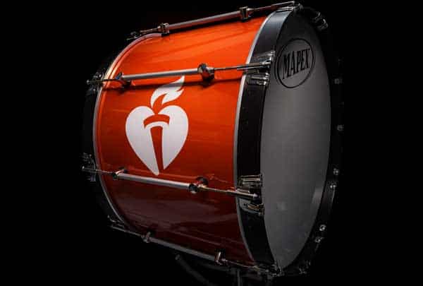 Close-up of a red bass drum featuring the American Heart Association logo